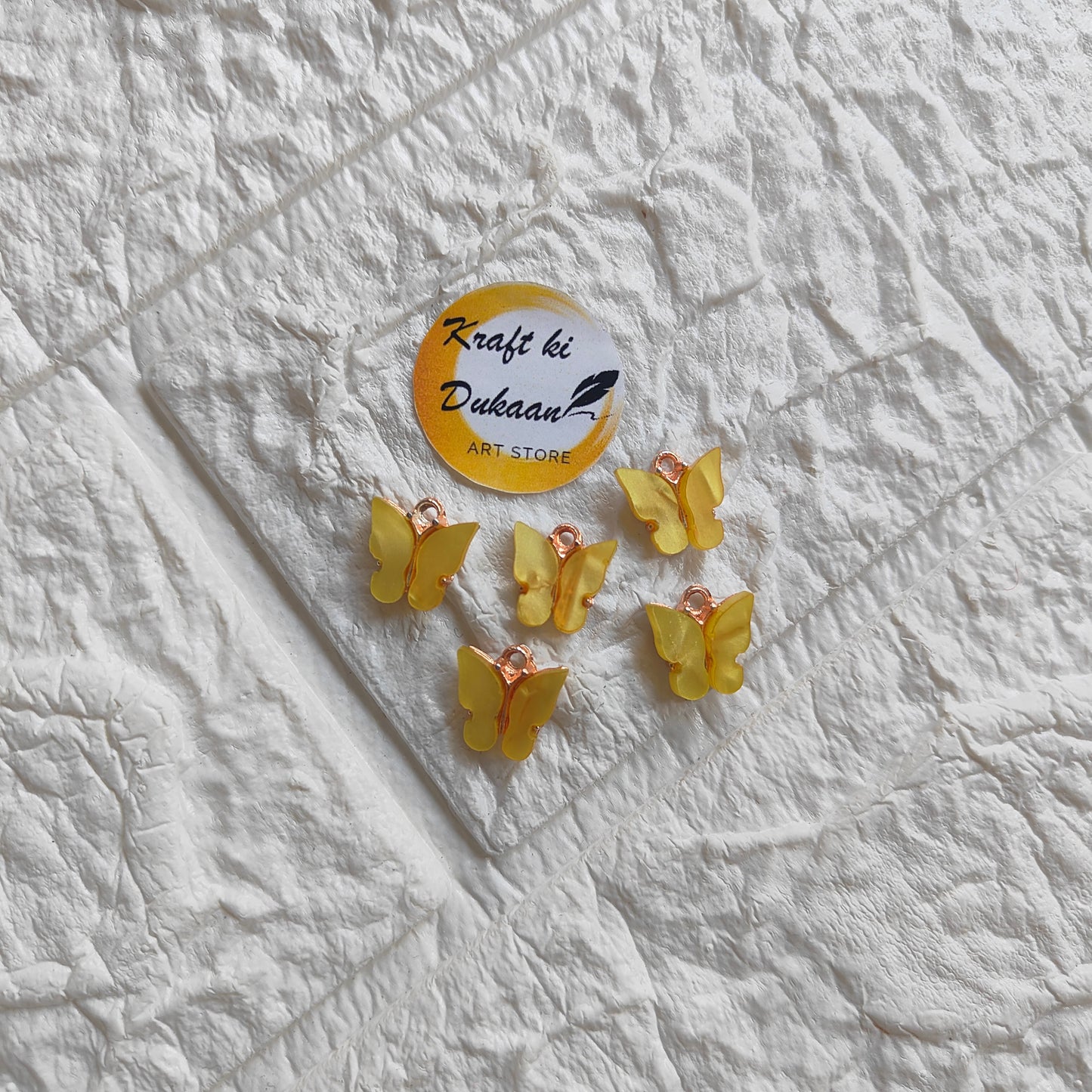 Set of five yellow butterfly resin pendant charms perfect for jewelry making and crafts