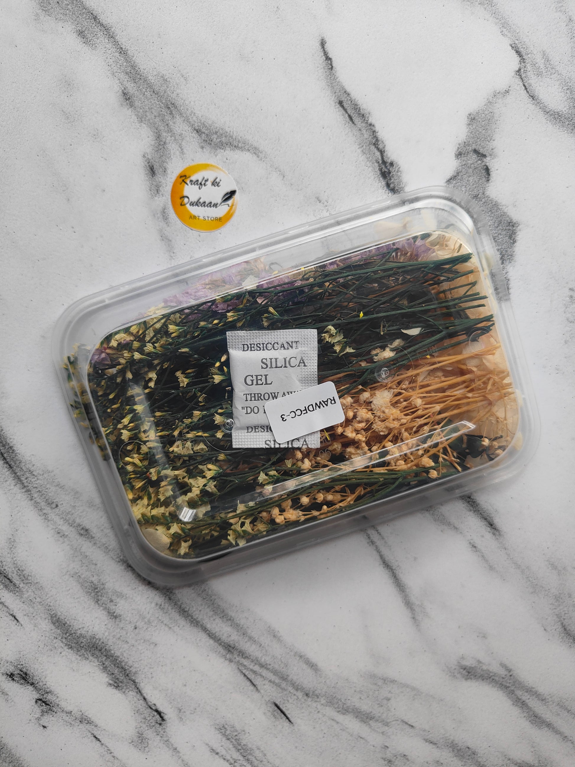 Assorted dried flowers in a clear container for decoration, perfect to buy dried flowers online