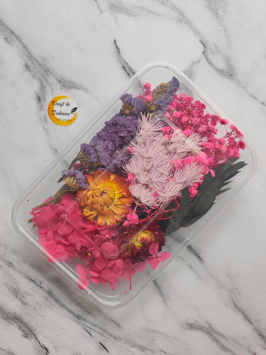 Colorful dried flower arrangement in a clear container, perfect to buy dried flowers online India
