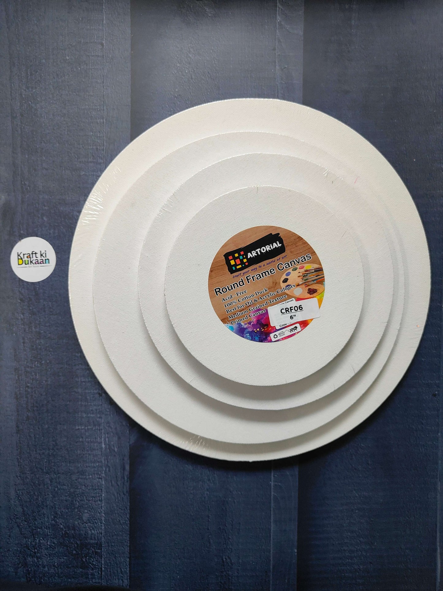 Round stretched canvas board with frame, white front with label