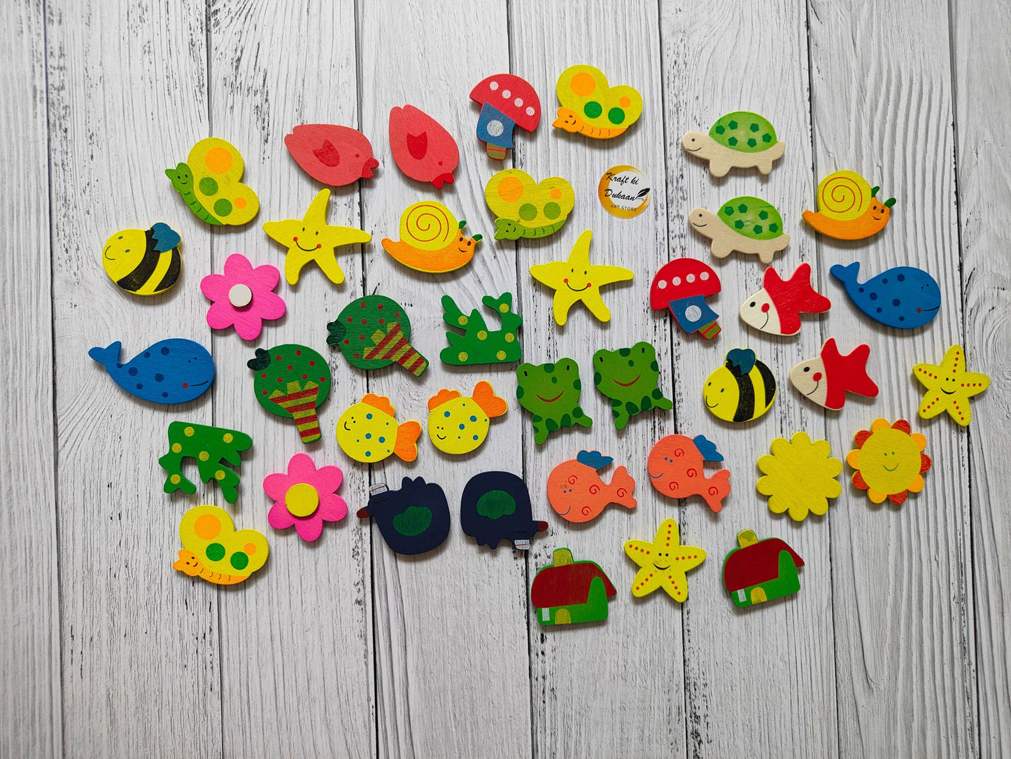 Assorted cartoon magnets set with fish, starfish, flowers, turtles and more