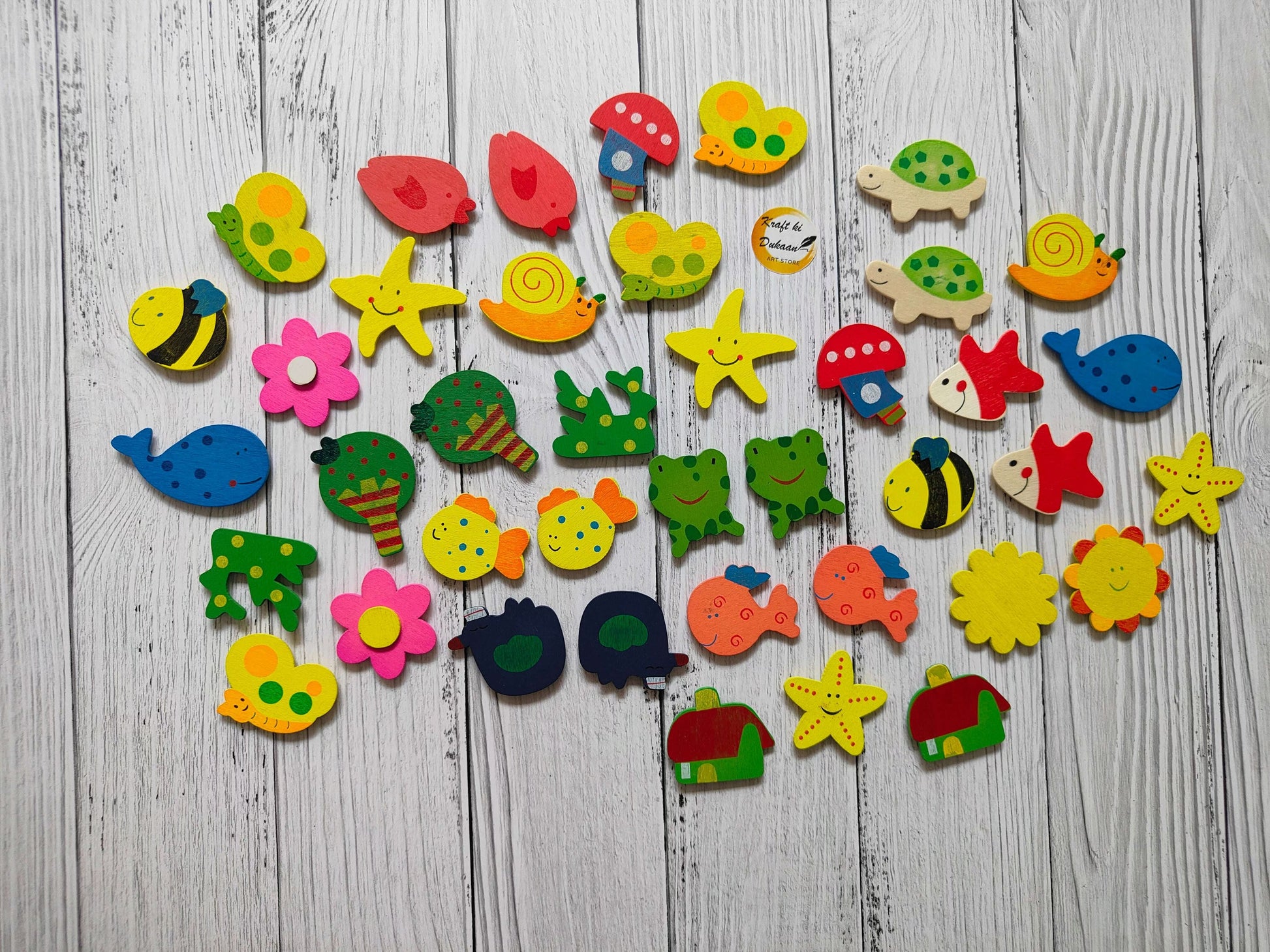 Assorted cartoon magnets set with fish, starfish, flowers, turtles and more