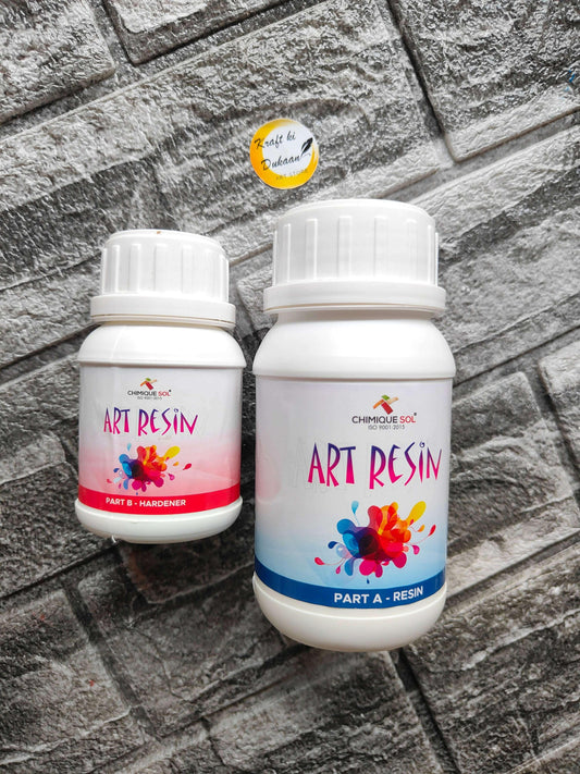 Epoxy resin and hardener set in white packaging for crafting and artwork projects