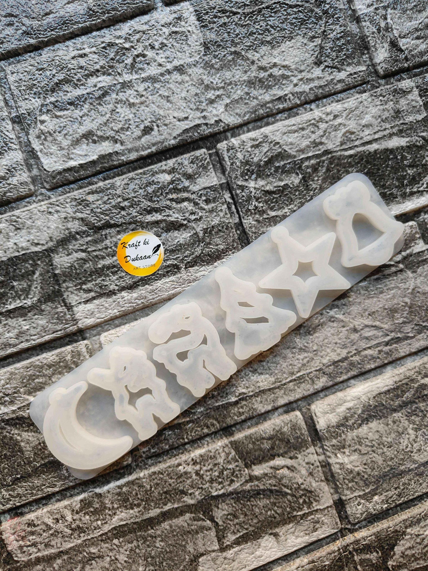 Translucent 6-cavity Christmas silicone mould bar with star and tree-shaped cavities