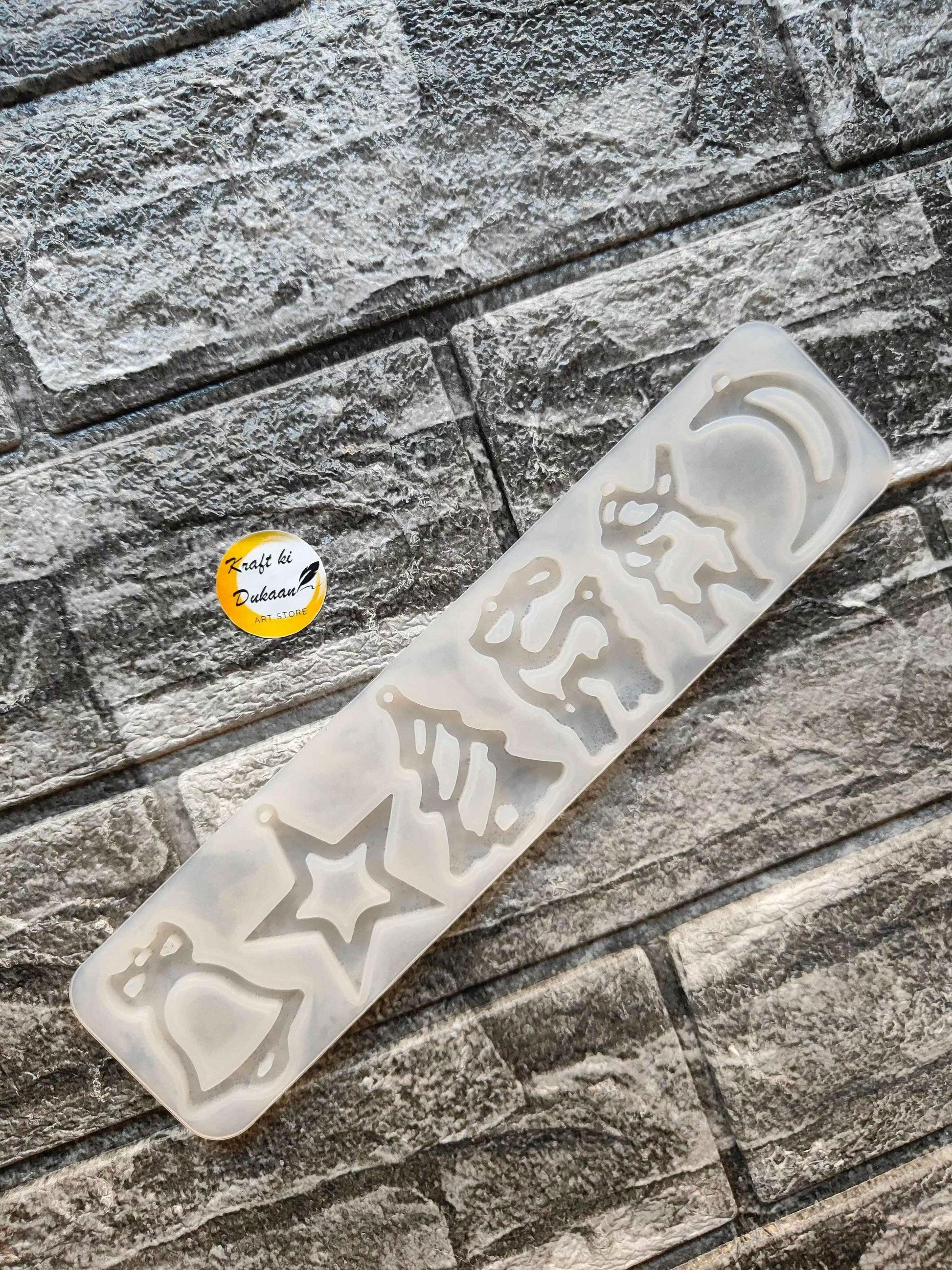 6 Cavity Christmas mould with translucent white tray and embossed holiday shapes