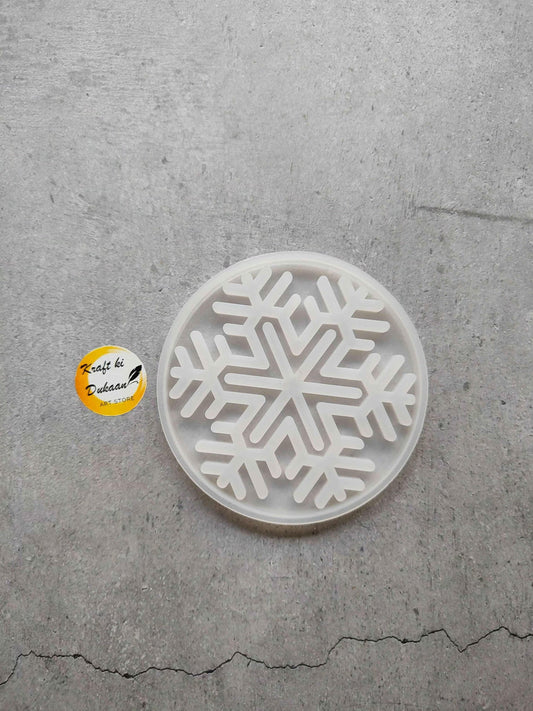 Round Christmas flakes mould with embossed snowflake pattern in white