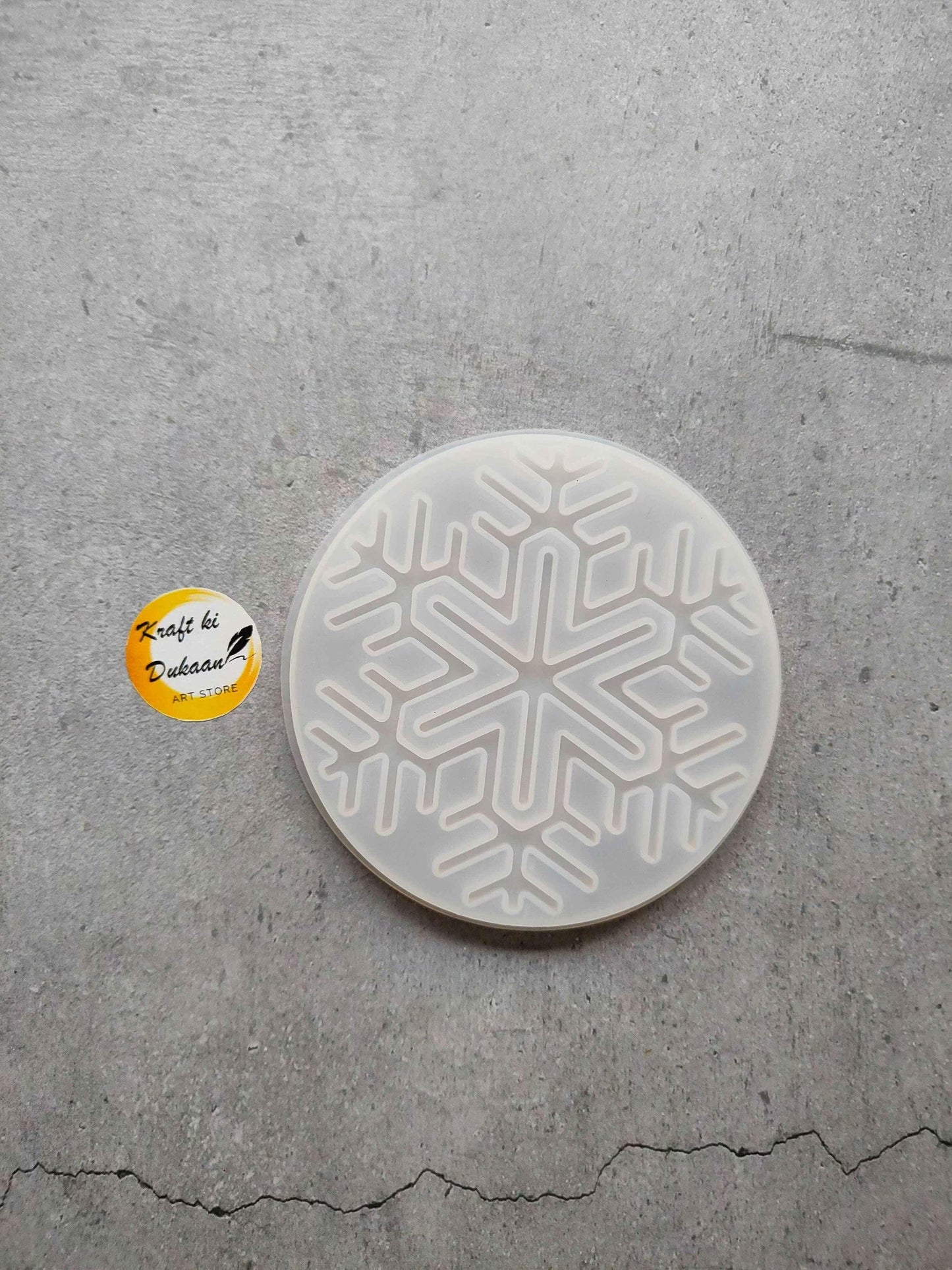 Round Christmas mould plate with raised snowflake cutout design