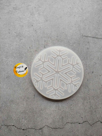Round Christmas mould plate with raised snowflake cutout design