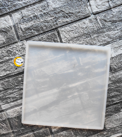Clear 8 inch silicone square mold by Kraft ki Dukaan on textured gray stone background