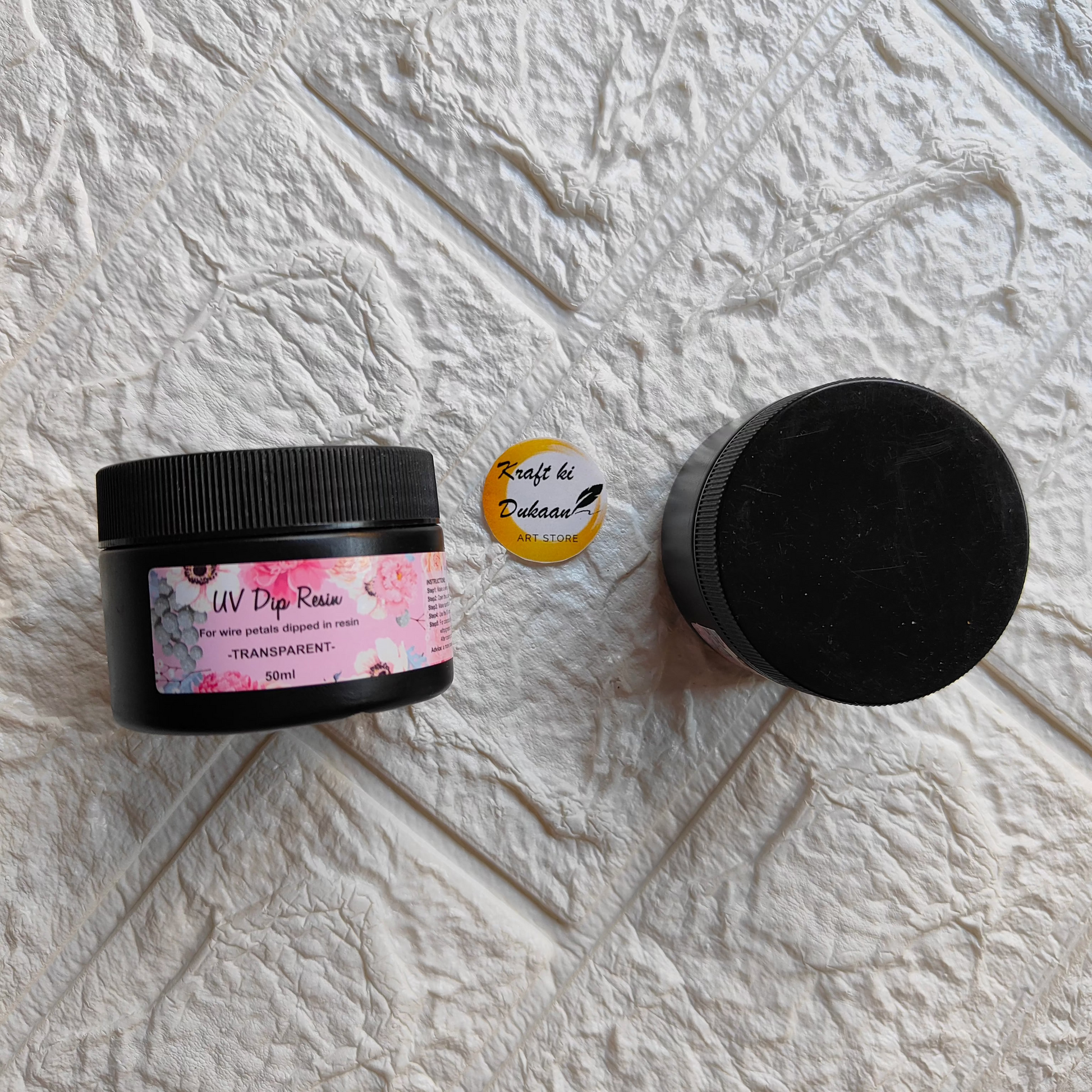 Kraft ki Dukaan clear UV dip resin in a 30ml black jar with a floral label for crafting projects