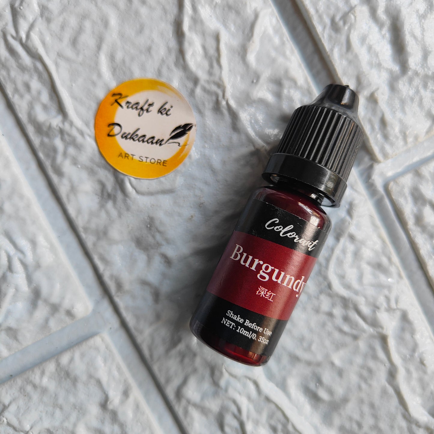 Burgundy resin colorant from Kraft ki Dukaan in a 100ml bottle for crafting projects