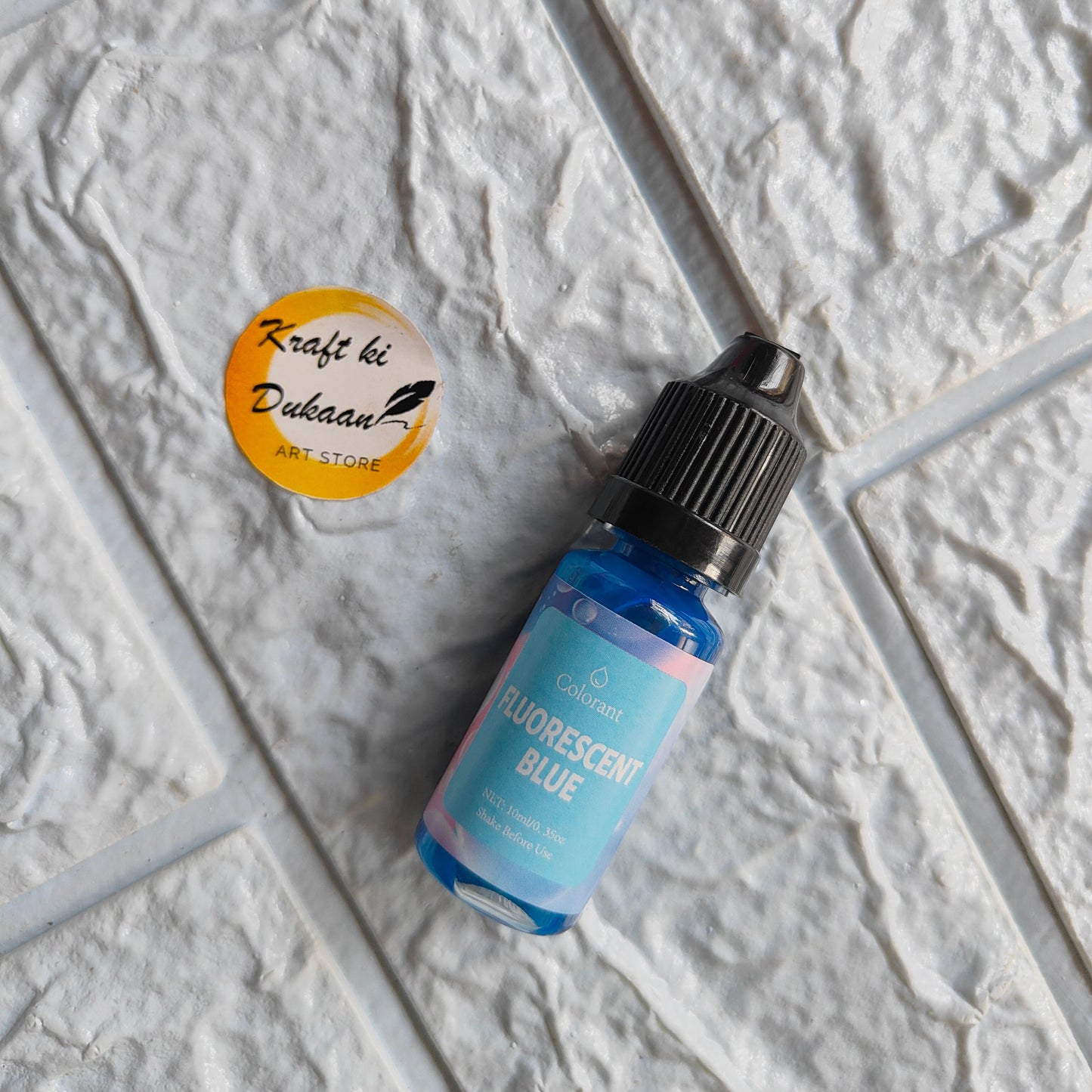 Fluorescent Blue Resin Pigment Colorant by Kraft ki Dukaan in a small dropper bottle