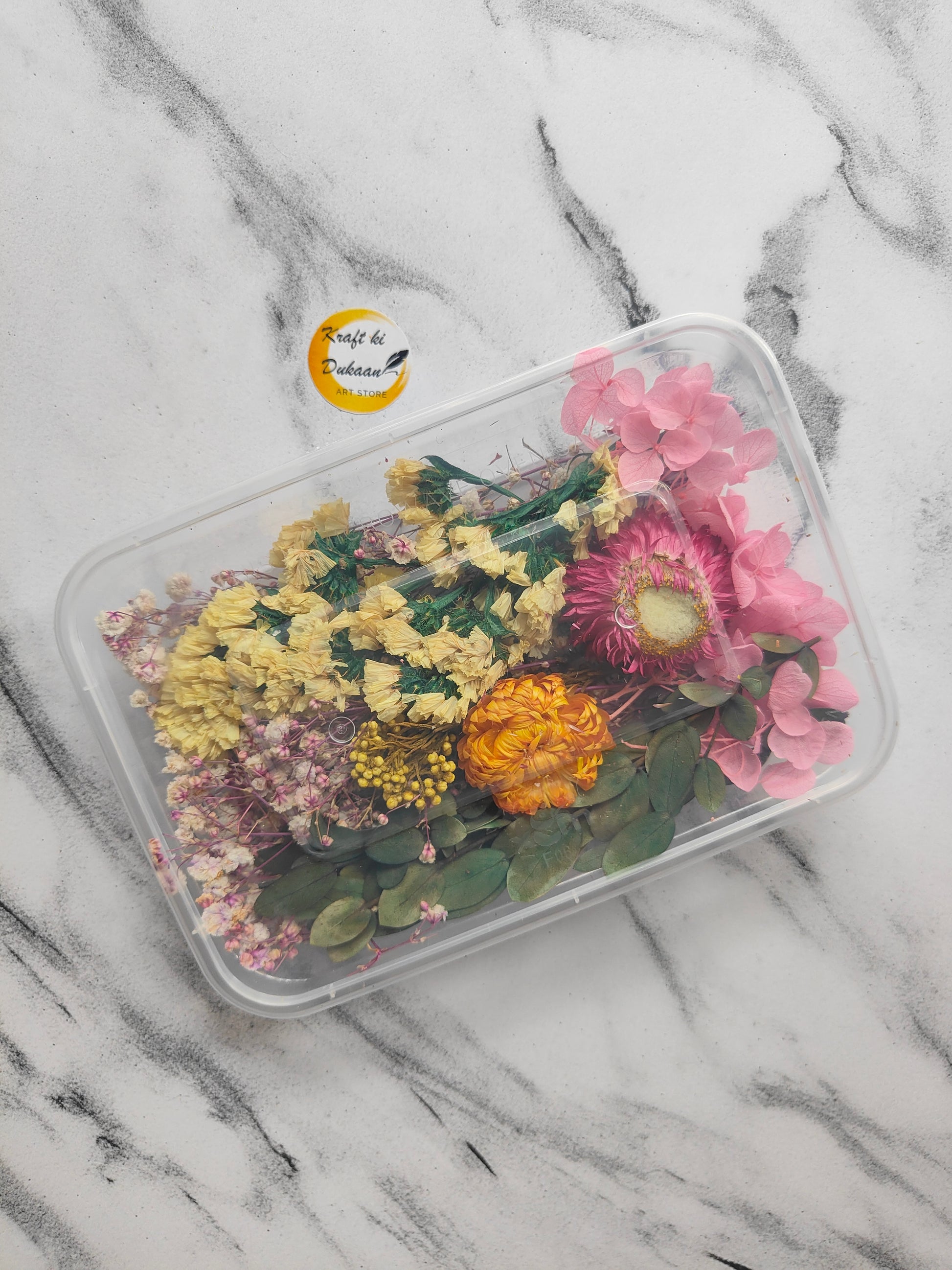Colorful dried flowers for epoxy resin arranged in a clear container from Kraft ki Dukaan
