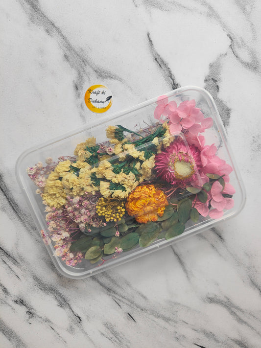 Colorful dried flowers for epoxy resin arranged in a clear container from Kraft ki Dukaan