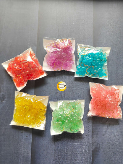 Assorted flower beads in color bags: red, pink, teal, yellow, green, lavender