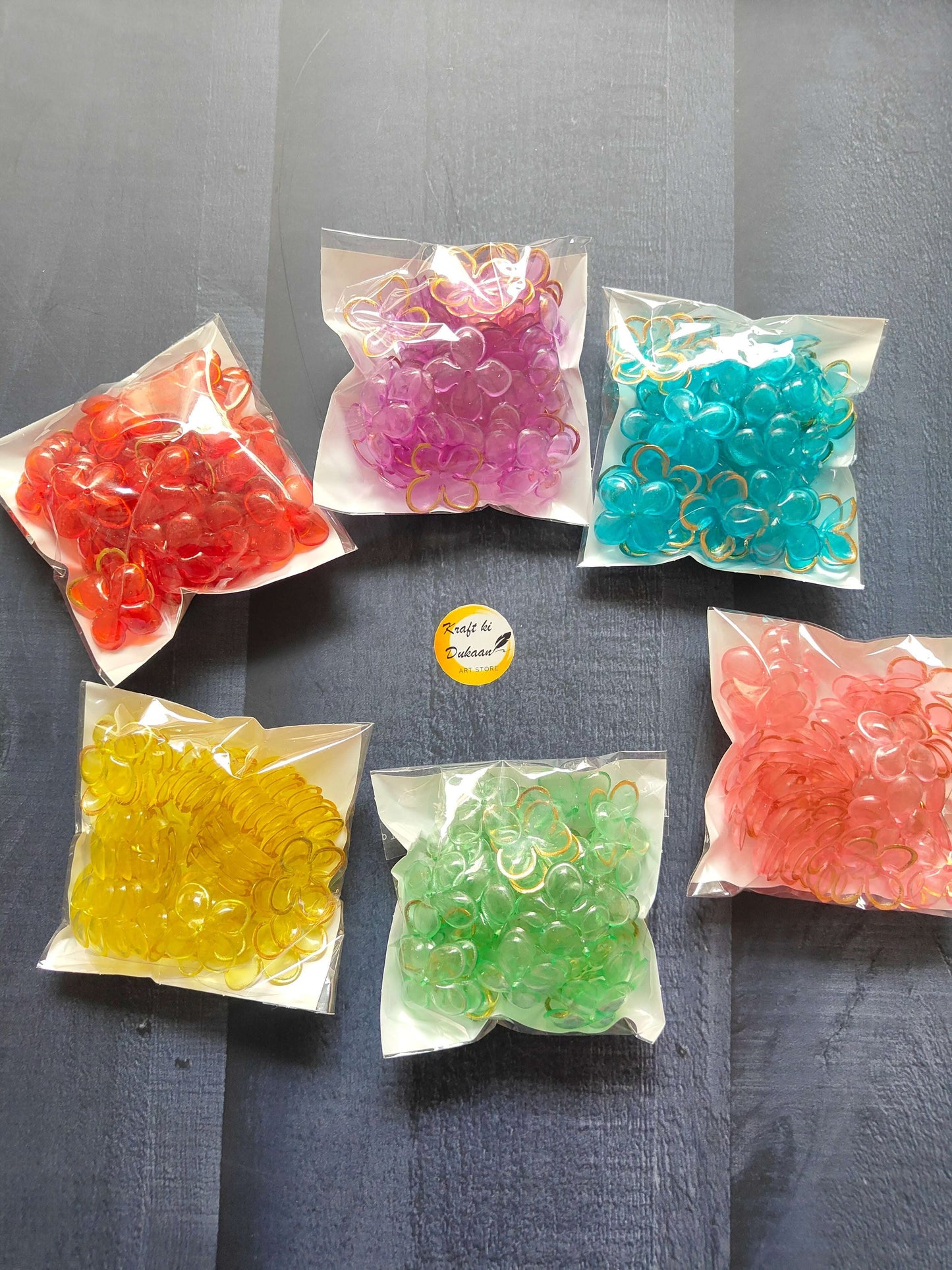 Assorted flower beads in color bags: red, pink, teal, yellow, green, lavender