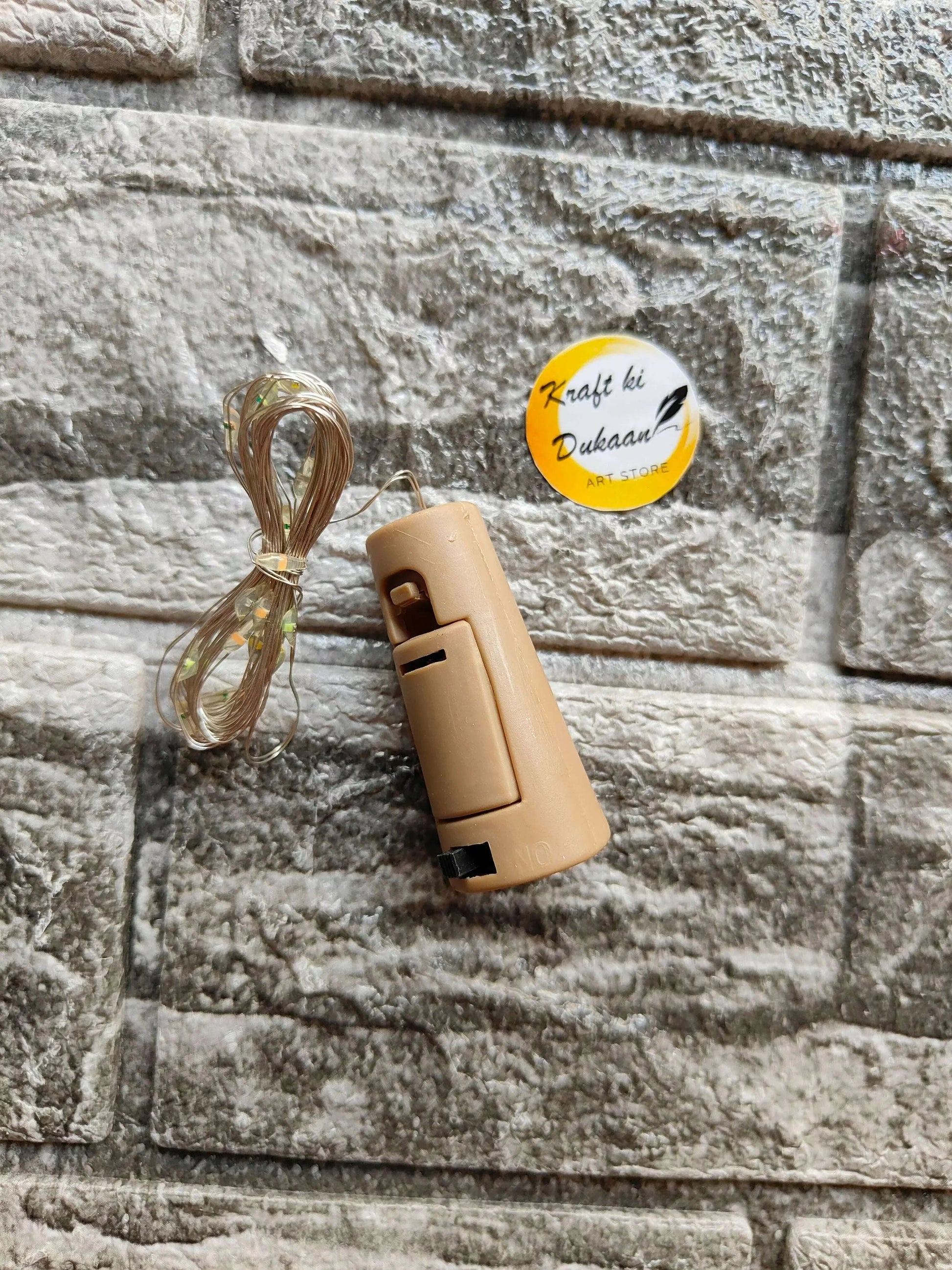Cork Light Multi—beige cylindrical lantern with cable bundle
