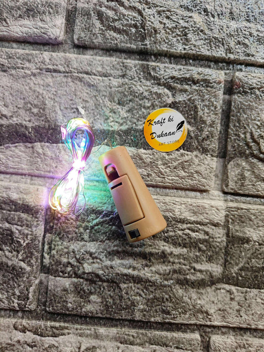 Cork Light Multi—beige light cylinder with braided cord and button slots