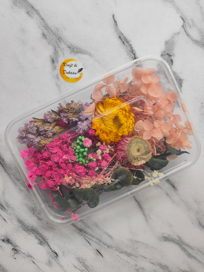 Colorful dried flowers for craft projects in a clear container from Kraft ki Dukaan