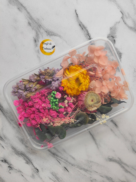 Colorful dried flowers for craft projects in a clear container from Kraft ki Dukaan
