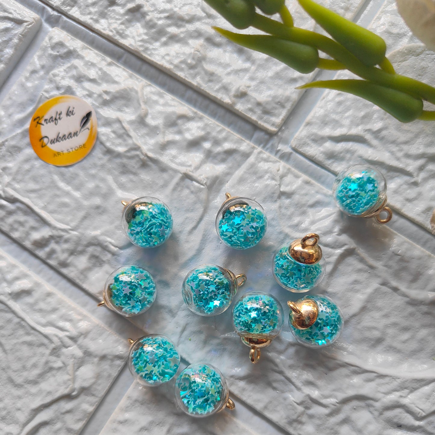 Kraft ki Dukaan craft glass ball pendants in shimmering turquoise with gold accents for jewelry making