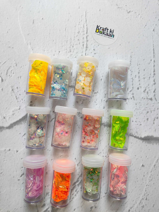 Sequins pack of 12 A2—twelve small containers filled with colorful glitter sequins