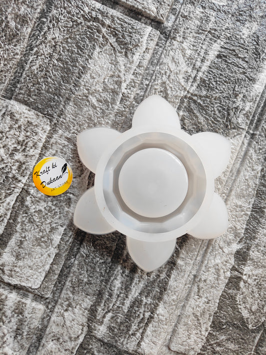 Lotus T-Light Holder Mold by Kraft ki Dukaan white flower-shaped silicone mold on textured surface