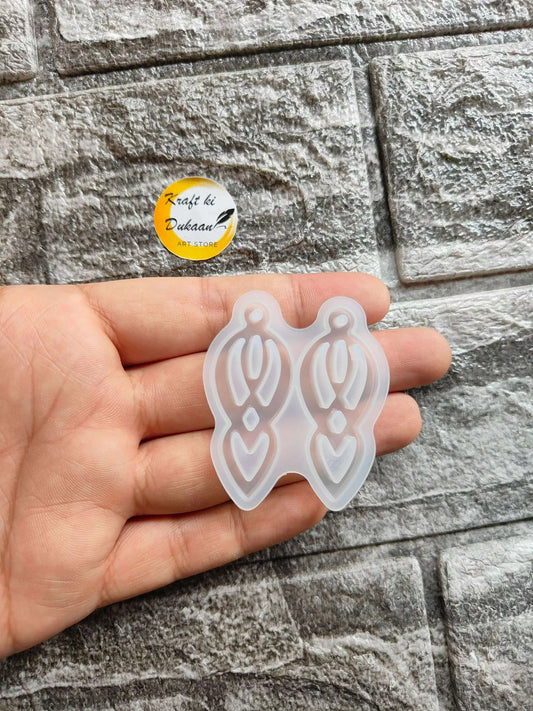 Earring mould A1, white double-hoop silicone-like design held in hand