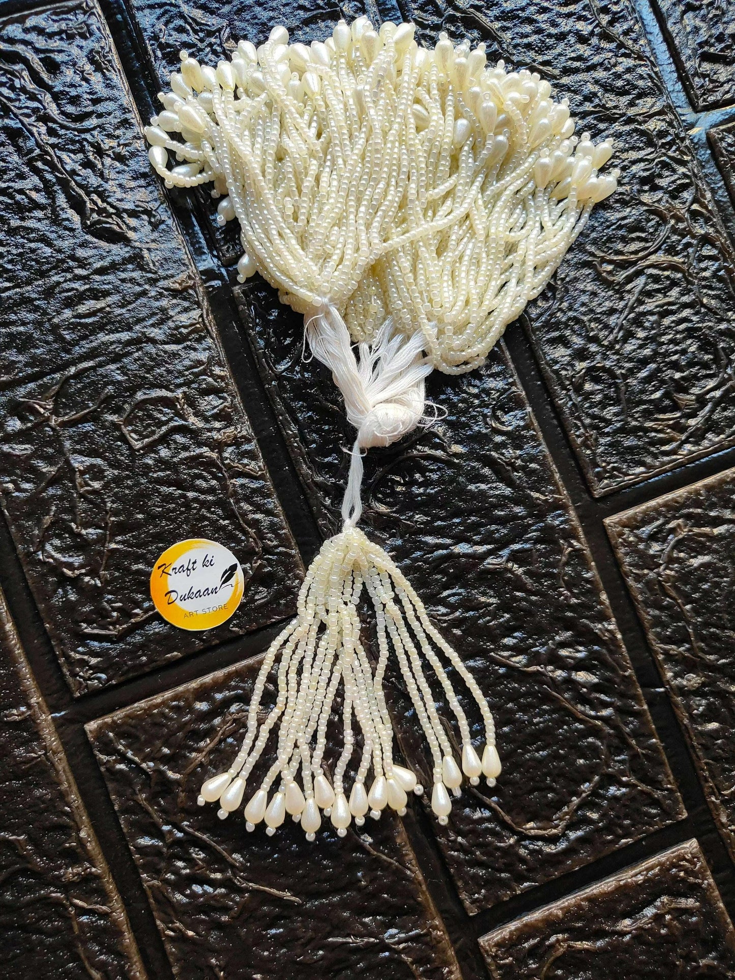Ivory beaded Latkan tassel with full fringe and white thread tie