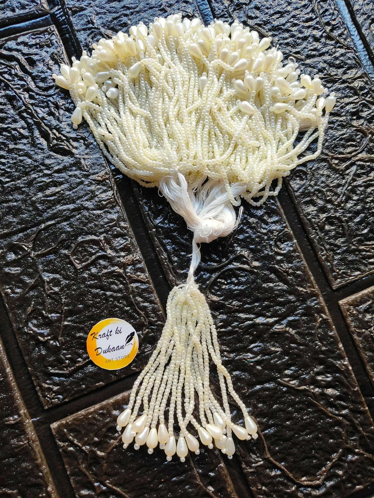 Ivory beaded Latkan tassel with long fringe and dangling pearl-like bead tips