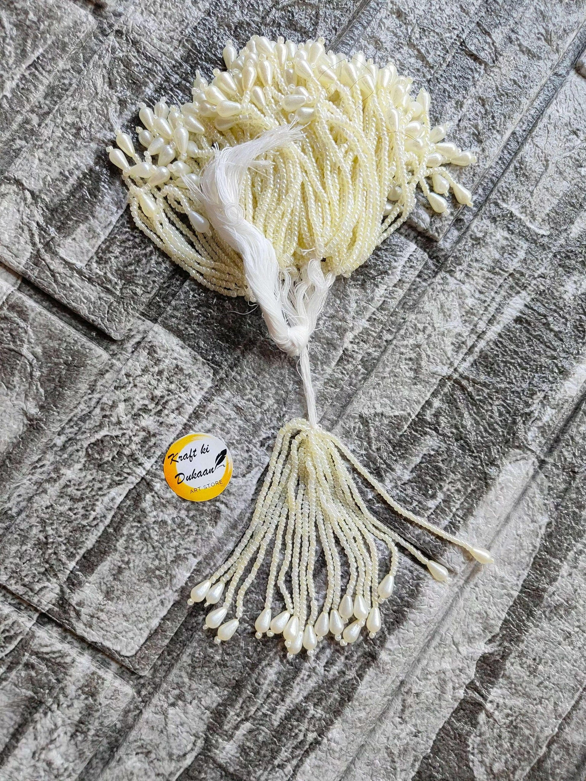 Ivory beaded Latkan tassel bundle with top tassel and long bottom fringe