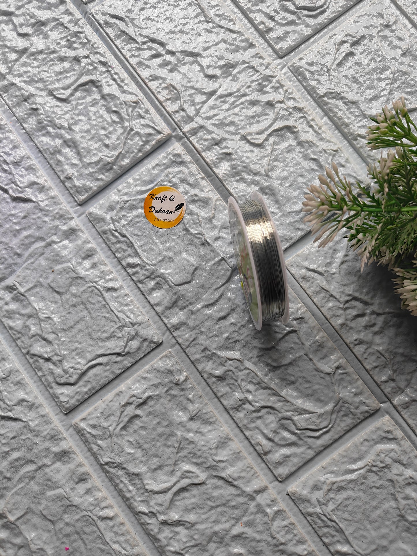 Craft wire roll 0.4mm on textured surface with Kraft ki Dukaan branding