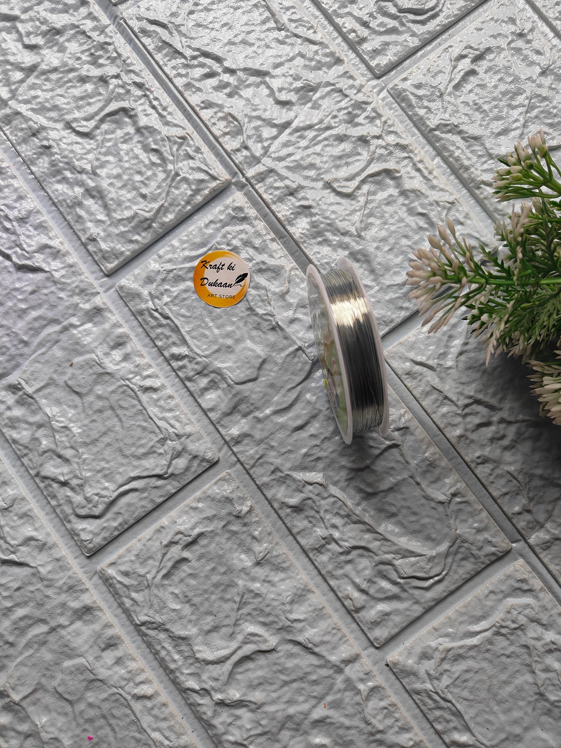 Craft wire roll 0.4mm on textured surface with Kraft ki Dukaan branding