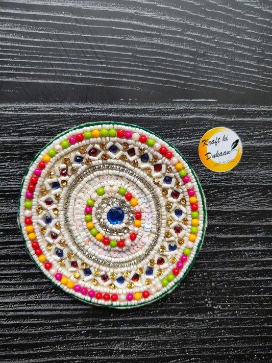 Beaded round decorative patch with blue center, multicolor border and gold accents