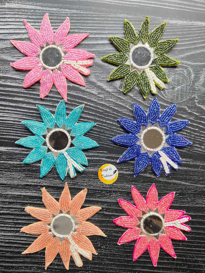 Set of beaded flower patches in pink, green, teal, blue, peach, and orange.