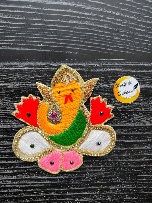 Decorative bird patch with orange body, red leaves, green wing, pink flowers and feet