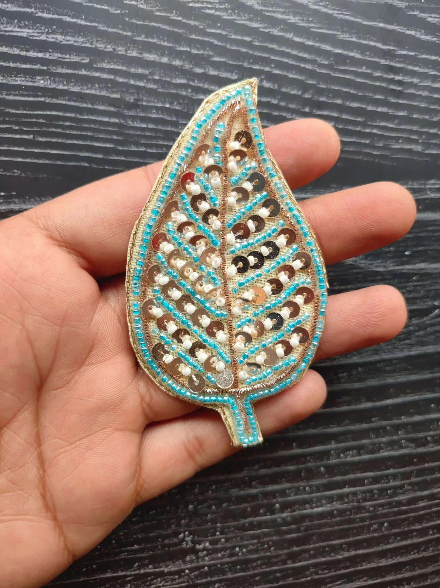 Teal blue sequin teardrop decorative patch with beadwork lines and dots