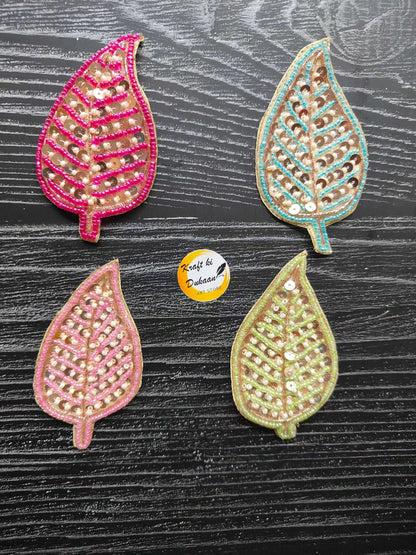 Set of four sequin teardrop decorative patches in pink, teal, and green