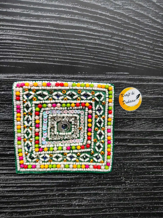 Decorative beaded patch, square design with colorful border and central eye pattern