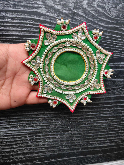 Green decorative patch with pearl beading and jeweled oval center, star shape