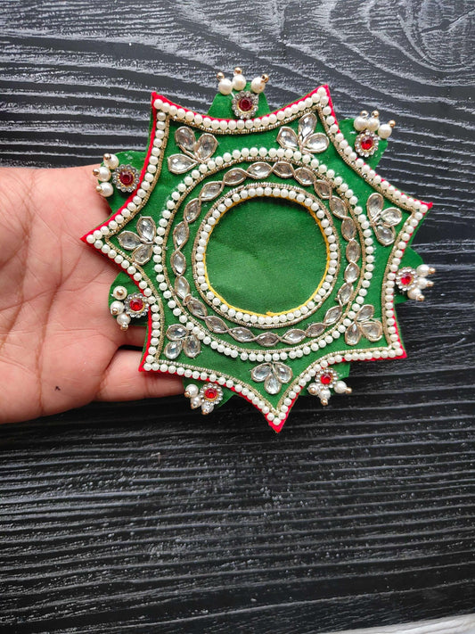 Green decorative patch with pearl beading and jeweled oval center, star shape