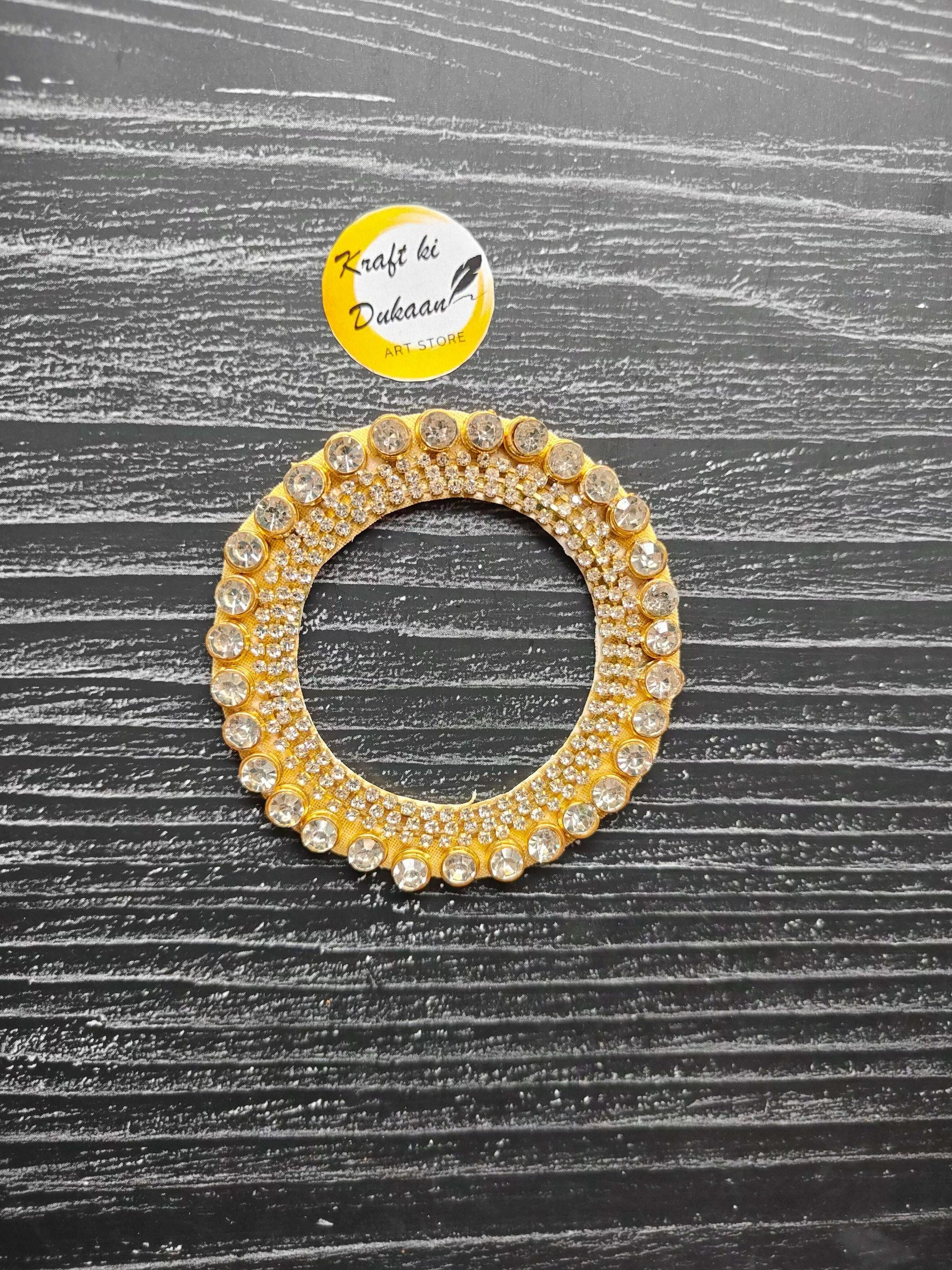 decorative-resin-patch-gold-circle-with-rhinestones-on-table