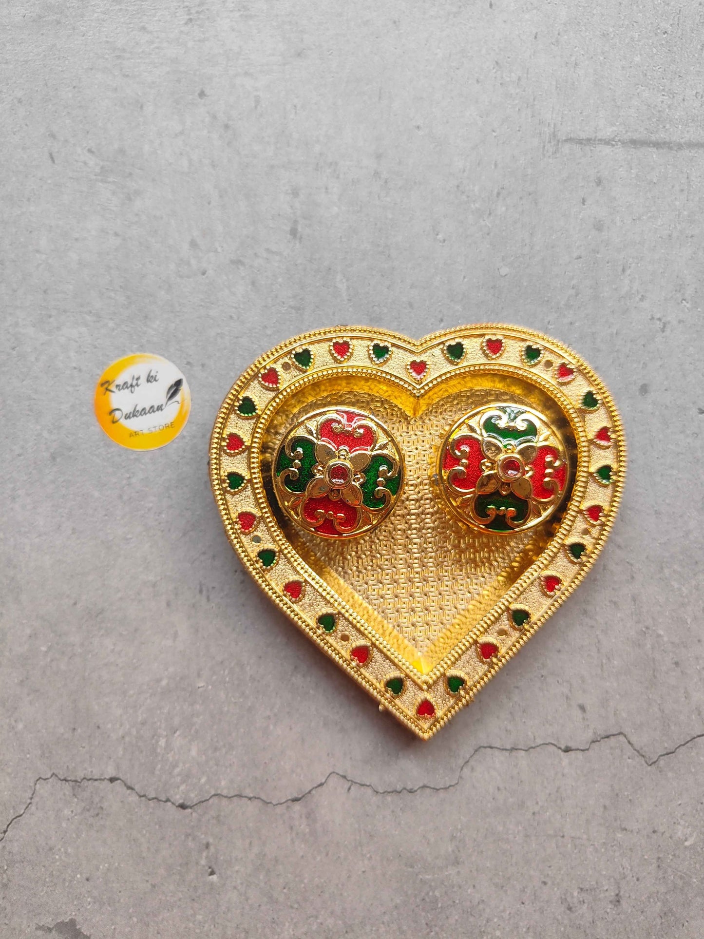 Decorative heart-shaped roli chawal plate for pooja with colorful floral designs