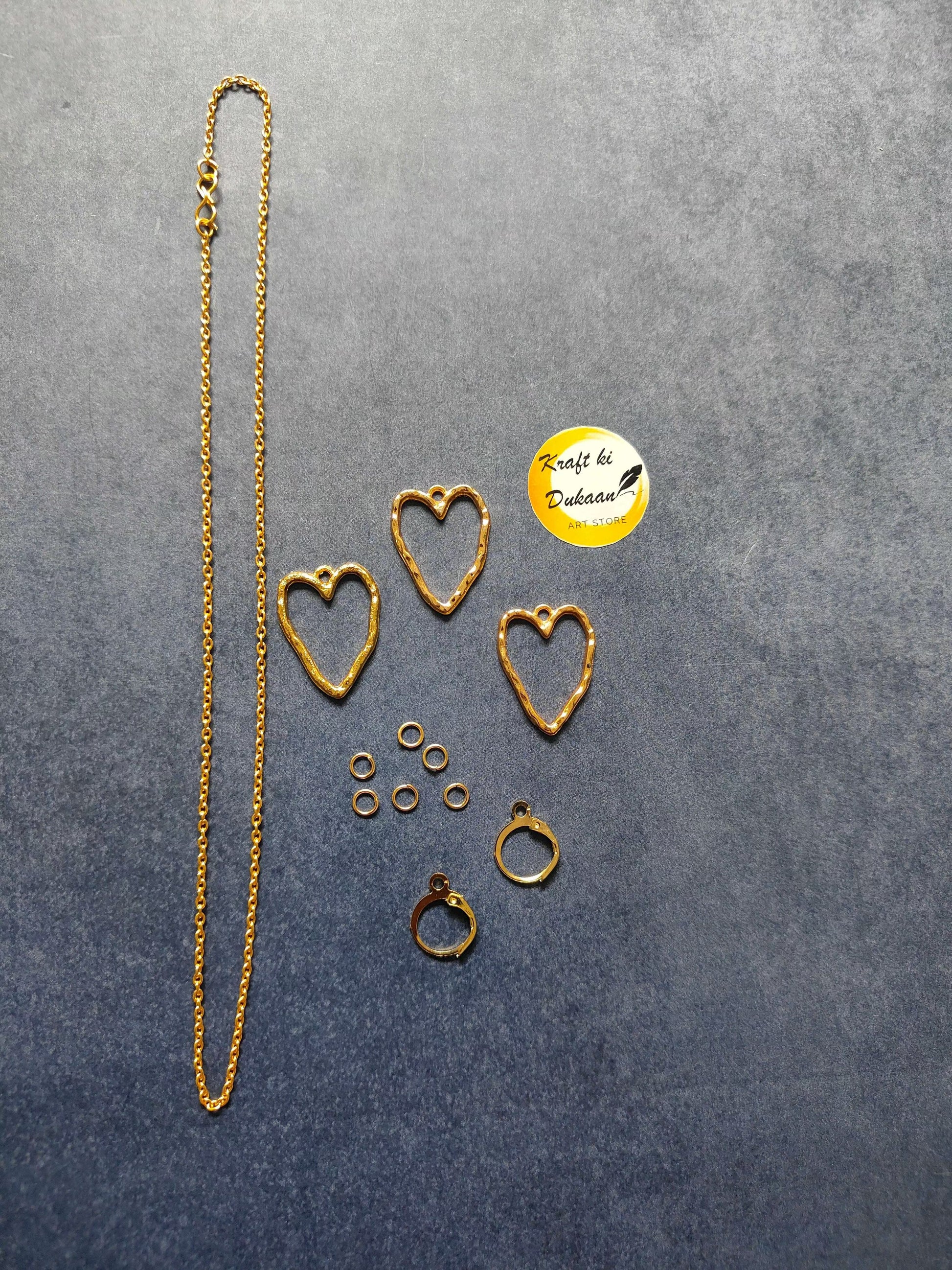 Gold heart pendant necklace chain with matching heart stud earrings and ring pieces