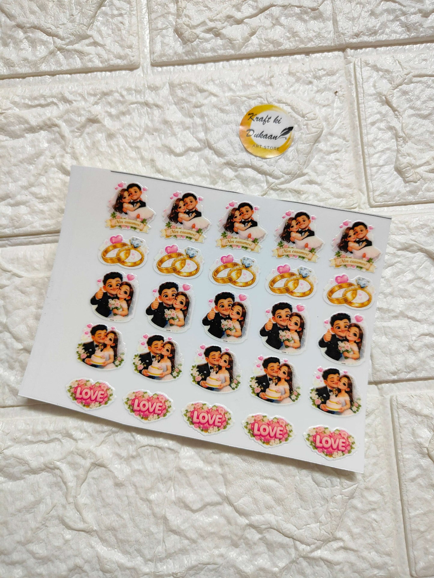 UV DTF peel-off sticker sheet with cartoon baby faces, rings, and “LOVE” icons