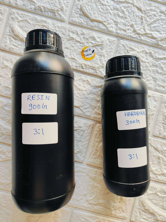 Epoxy resin and hardener bottles set with labels on two dark plastic containers