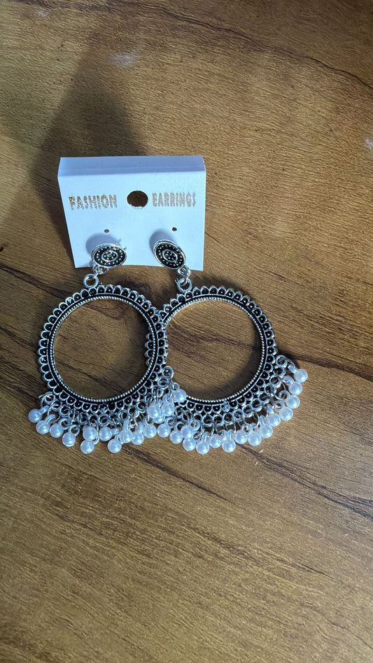 Fashion earrings beaded in silver with large circular design and pearl accents, perfect for casual wear