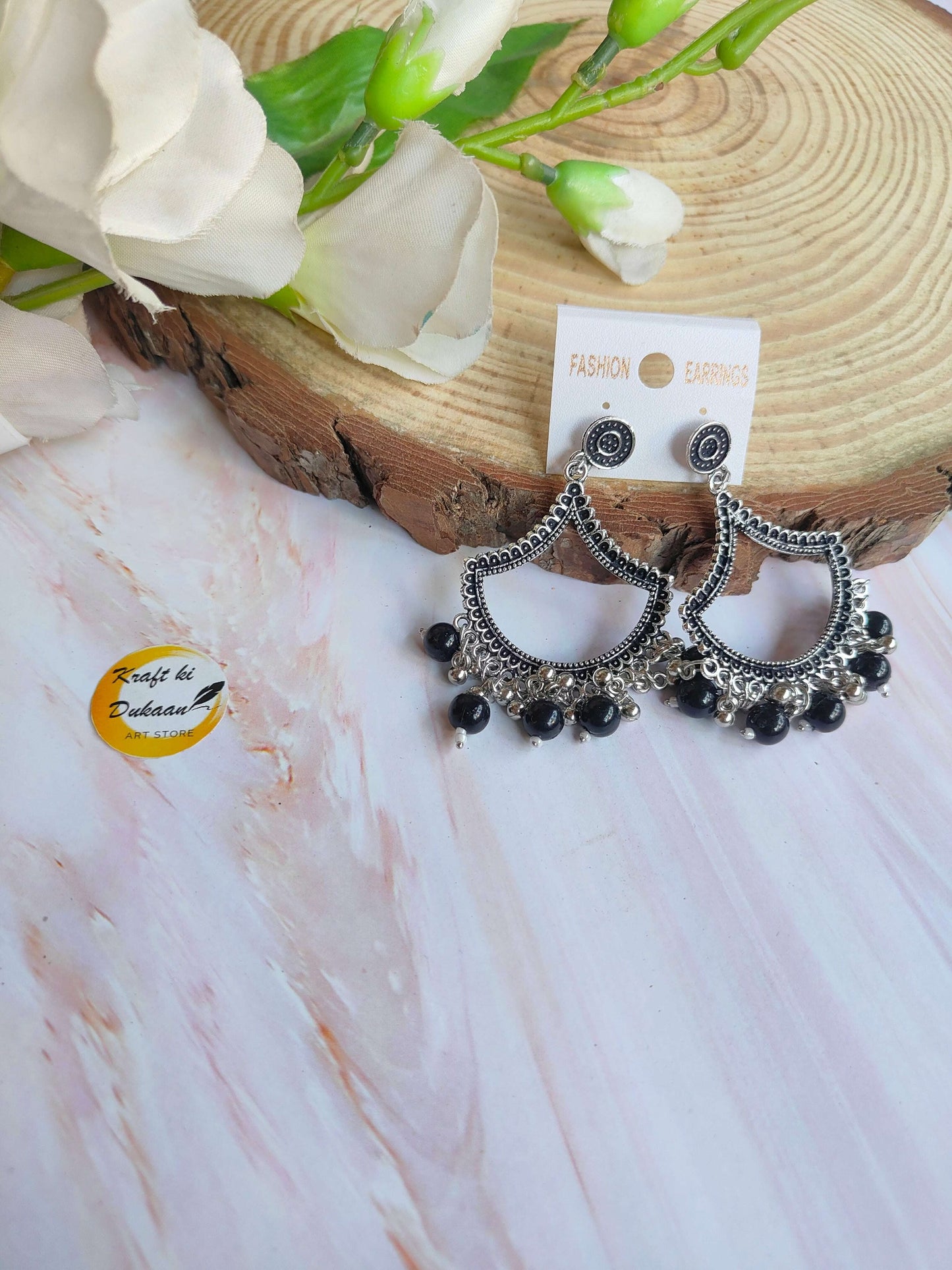 Kraft ki Dukaan silver jhumka earrings with intricate design and black bead detailing