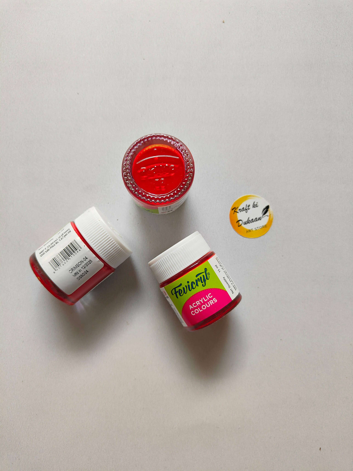Acrylic colour jars with a red cap and red paint jar, plus white screw lids