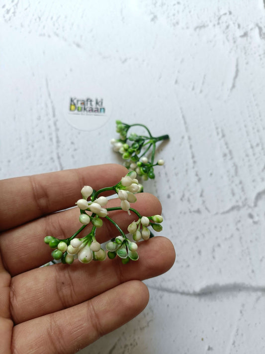 Artificial flower bunch with white blossoms and green buds on small stems
